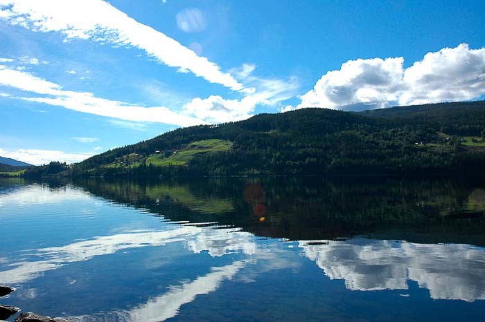 Reflective view of a Norwegian fjord.