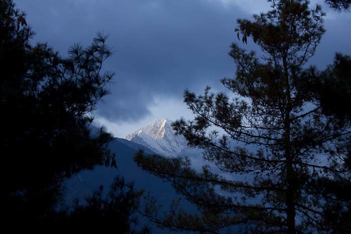 Everest Base Camp Day 2 - pines, clouds and Kong De peak, coming into Namche Bazar.